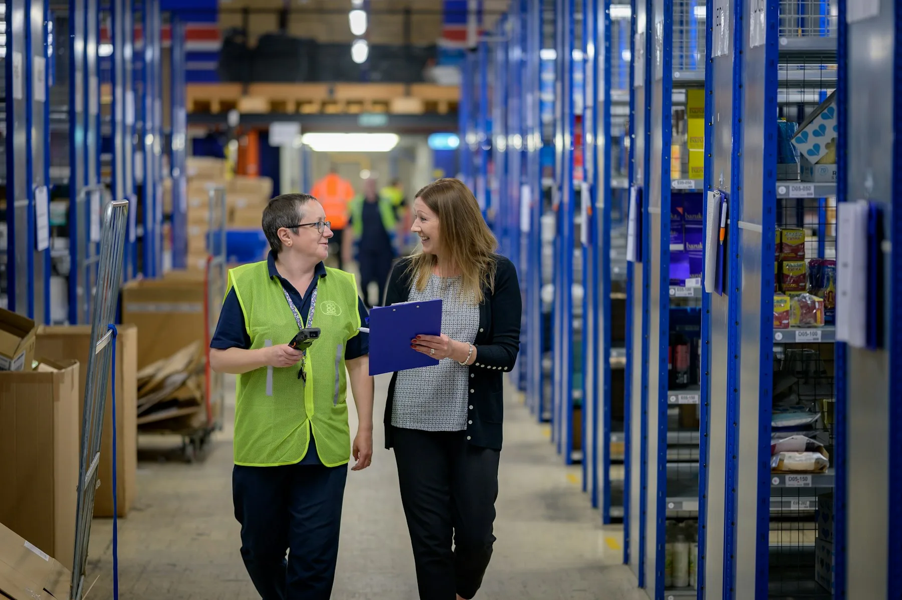 Professional logistics team working together in a warehouse